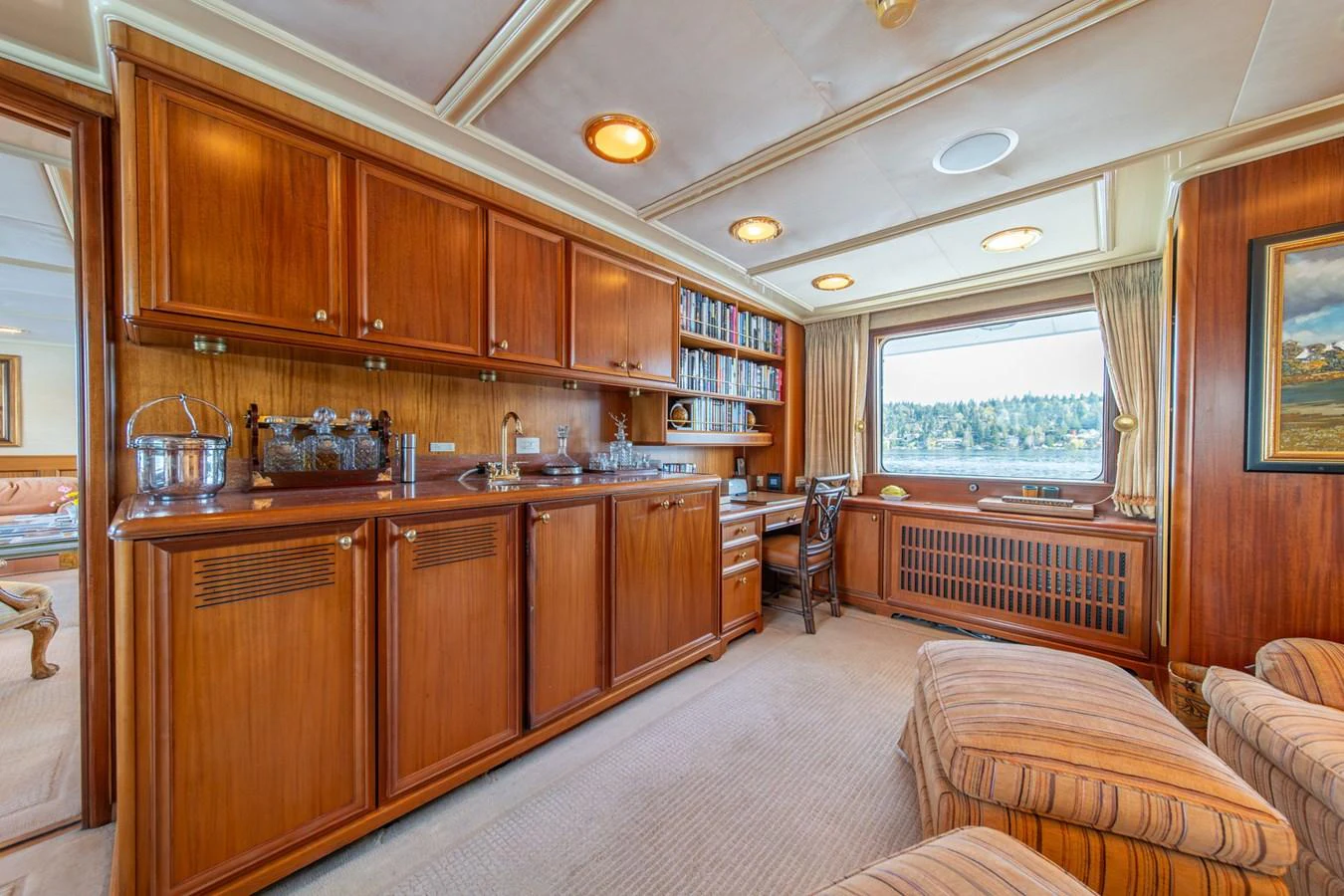 a kitchen with wooden cabinets aboard ESCAPE OF LONDON Yacht for Sale