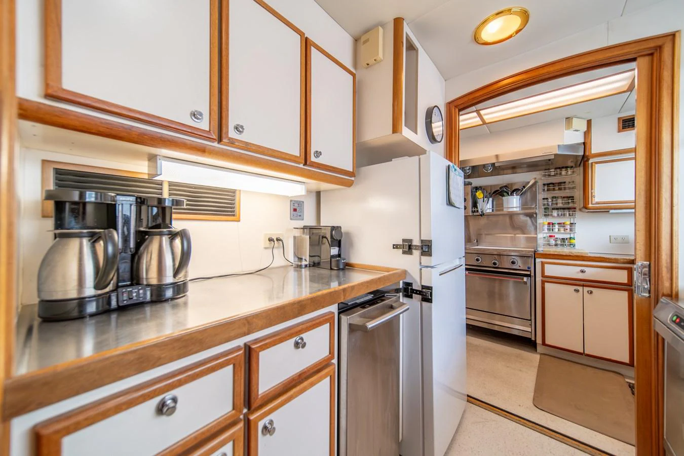 a kitchen with a stainless steel oven aboard ESCAPE OF LONDON Yacht for Sale