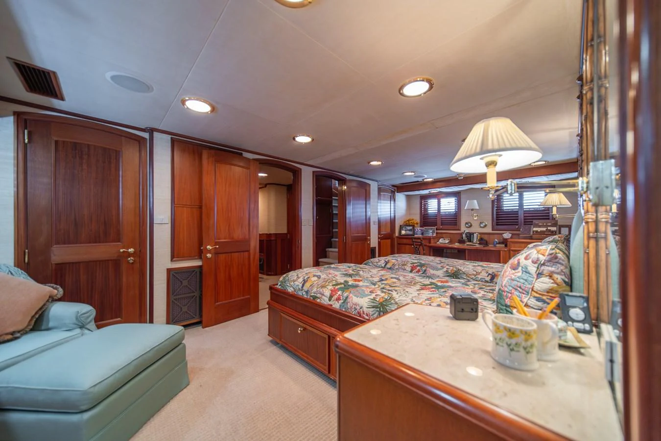 a bedroom with a bed and a couch aboard ESCAPE OF LONDON Yacht for Sale