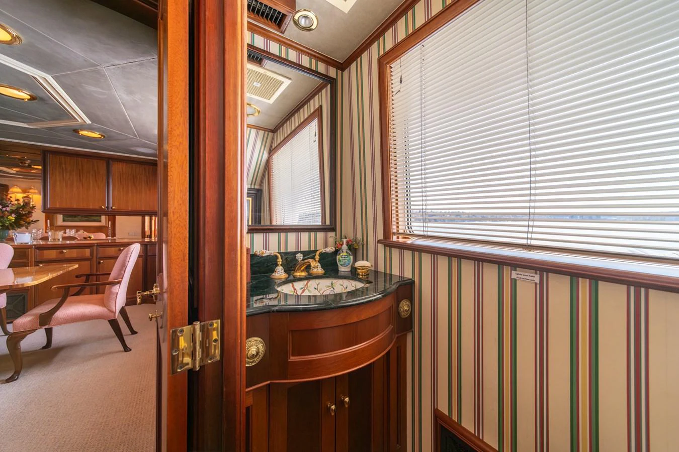 a kitchen with a sink and a window aboard ESCAPE OF LONDON Yacht for Sale