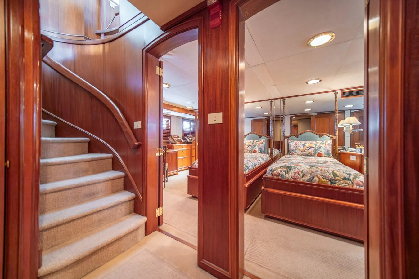 a room with a bed and a staircase aboard ESCAPE OF LONDON Yacht for Sale
