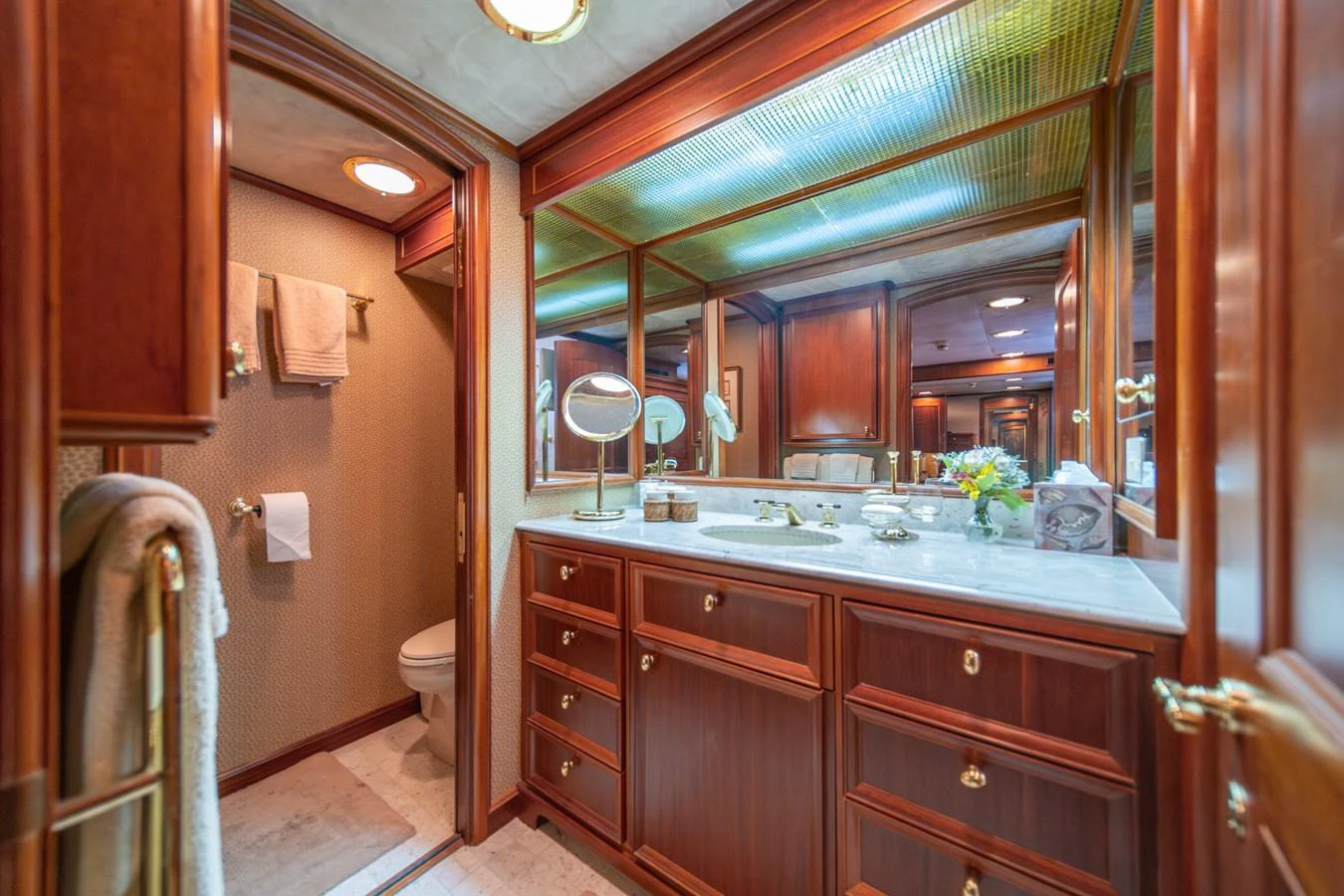 a bathroom with a large mirror aboard ESCAPE OF LONDON Yacht for Sale