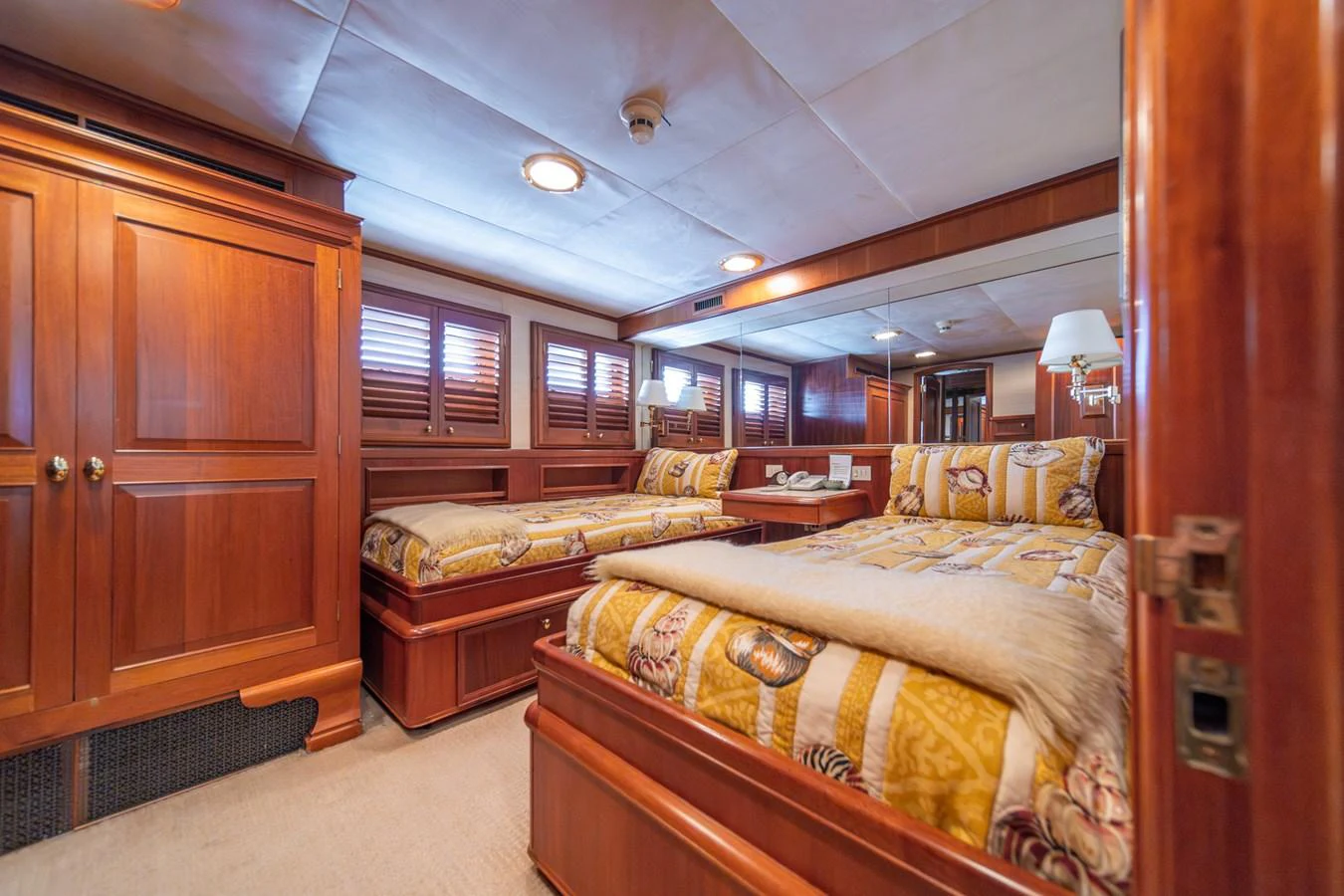 a room with a couple of beds aboard ESCAPE OF LONDON Yacht for Sale