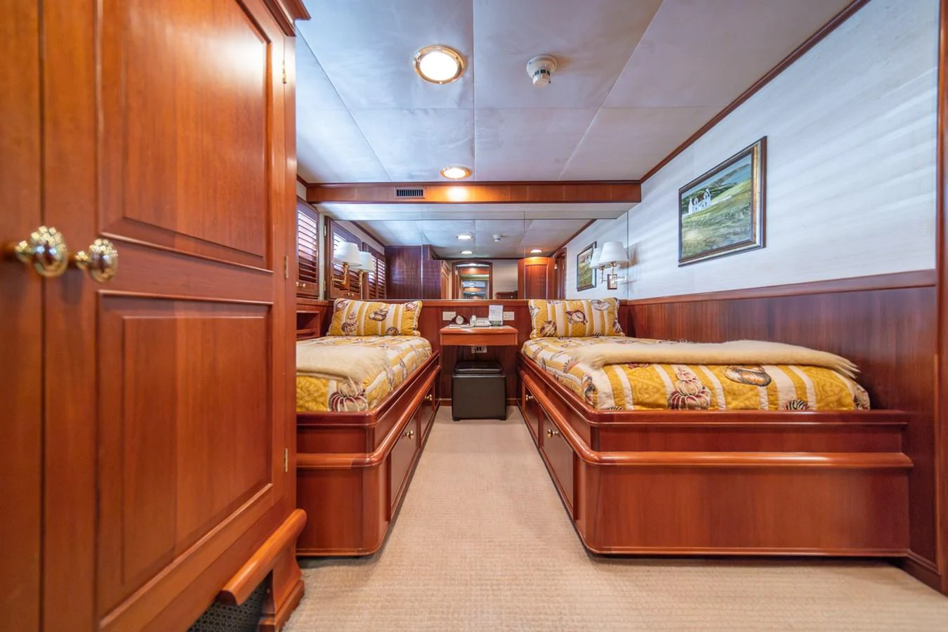 a room with a bed and a desk aboard ESCAPE OF LONDON Yacht for Sale