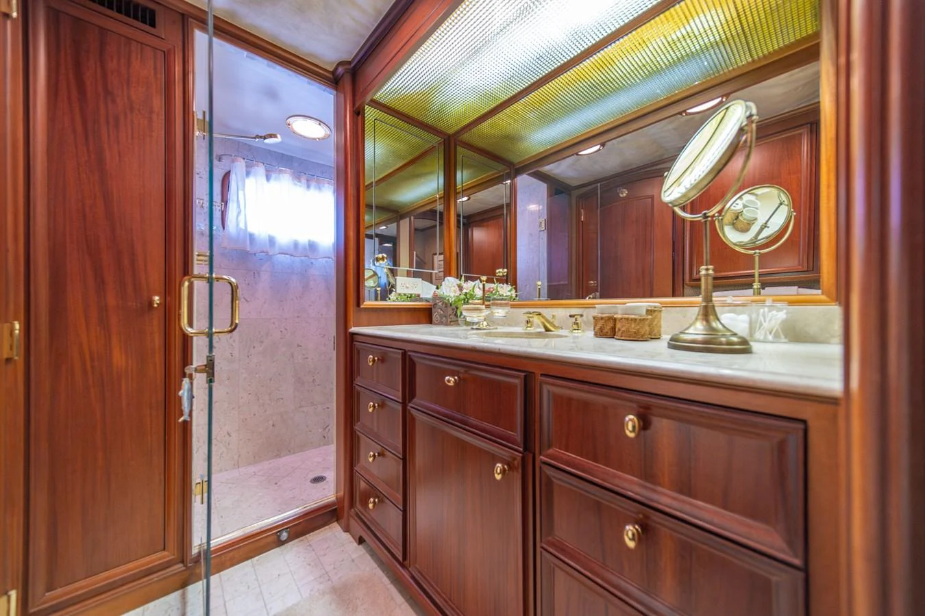 a bathroom with a large mirror aboard ESCAPE OF LONDON Yacht for Sale