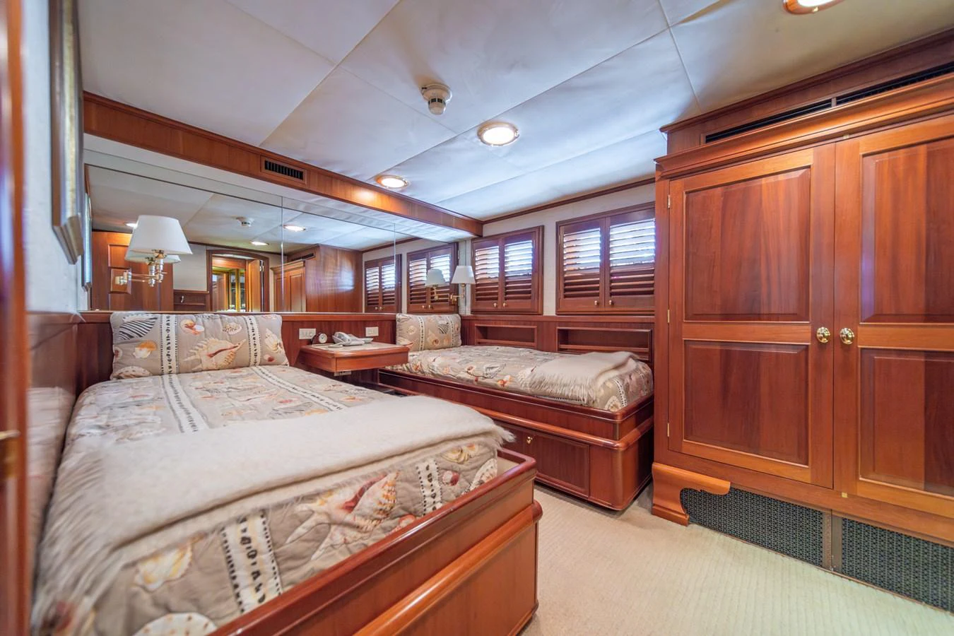 a bedroom with two beds aboard ESCAPE OF LONDON Yacht for Sale