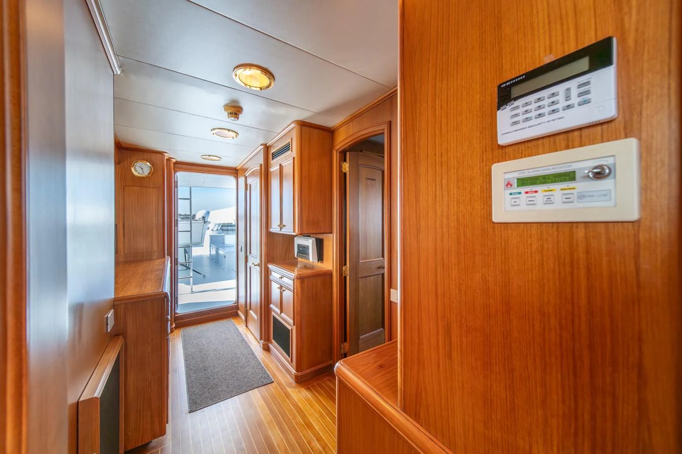 a hallway with wooden cabinets aboard ESCAPE OF LONDON Yacht for Sale
