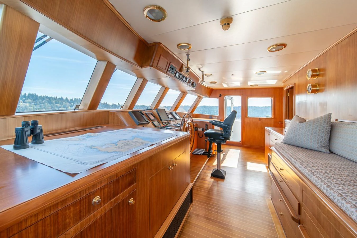 a room with a bed and a chair aboard ESCAPE OF LONDON Yacht for Sale