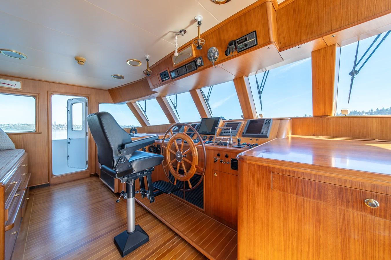 a room with a large table and chairs aboard ESCAPE OF LONDON Yacht for Sale