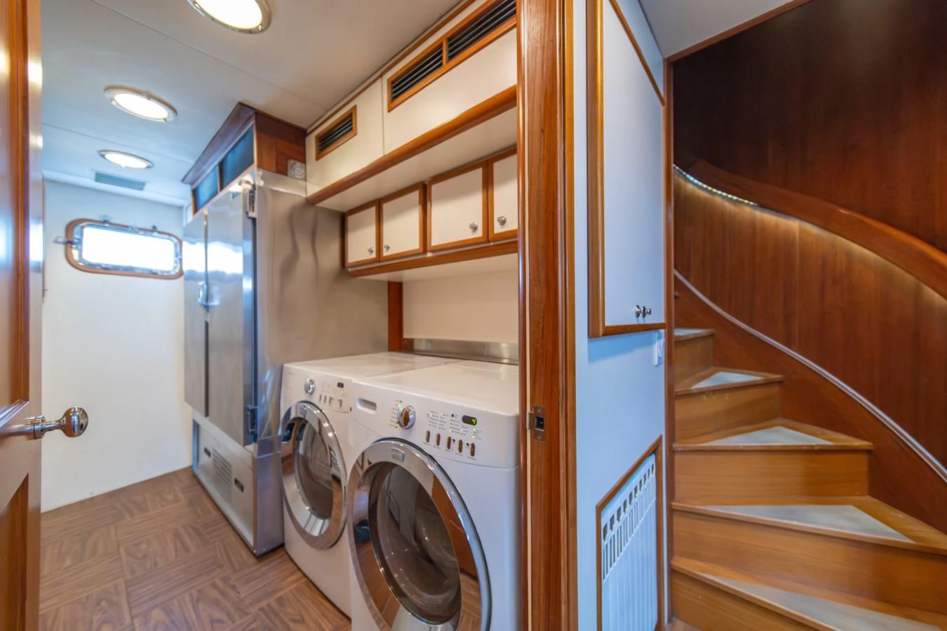 a laundry room with a dryer aboard ESCAPE OF LONDON Yacht for Sale