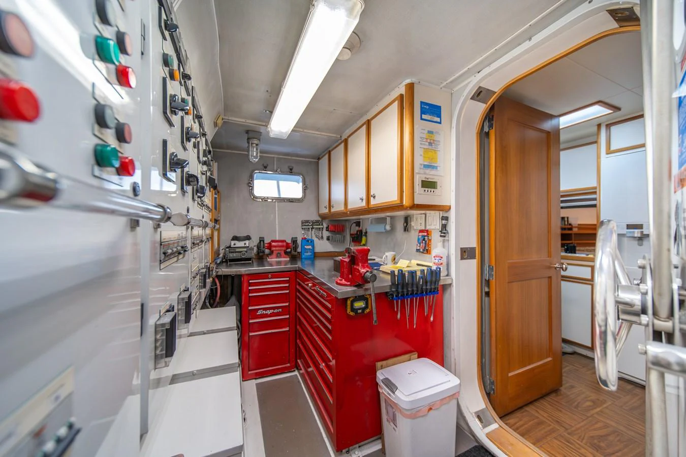 a room with a machine and cabinets aboard ESCAPE OF LONDON Yacht for Sale