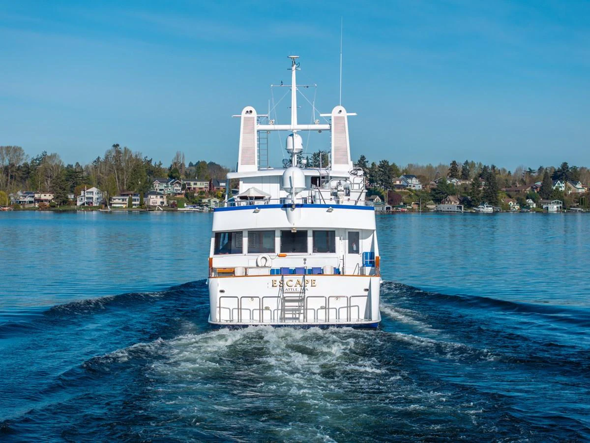 a white boat on water aboard ESCAPE OF LONDON Yacht for Sale