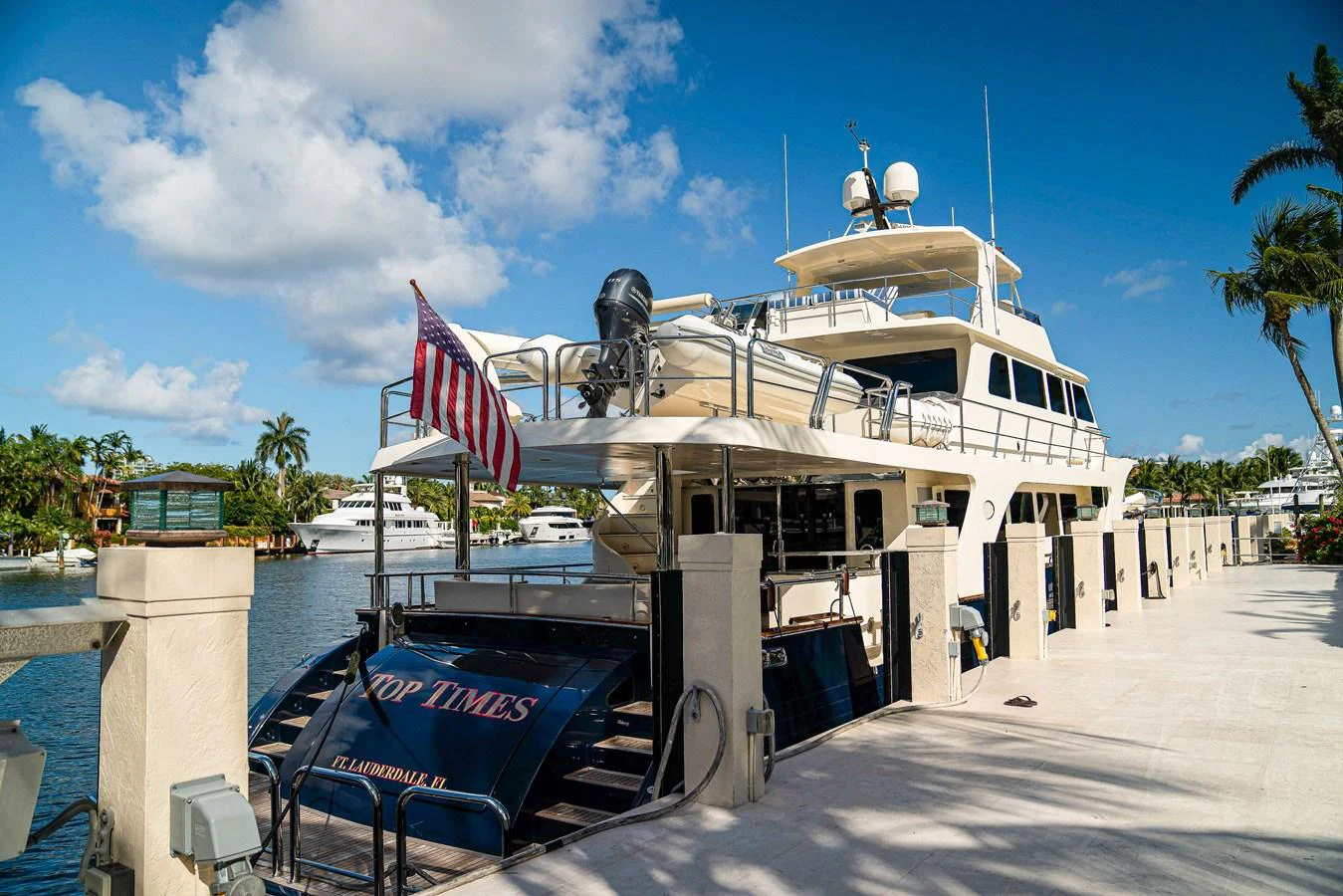 a boat docked at a pier aboard TOP TIMES Yacht for Sale