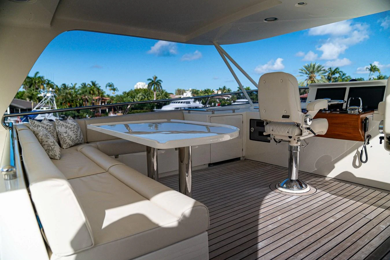 a lounge area with a table and chairs on it aboard TOP TIMES Yacht for Sale
