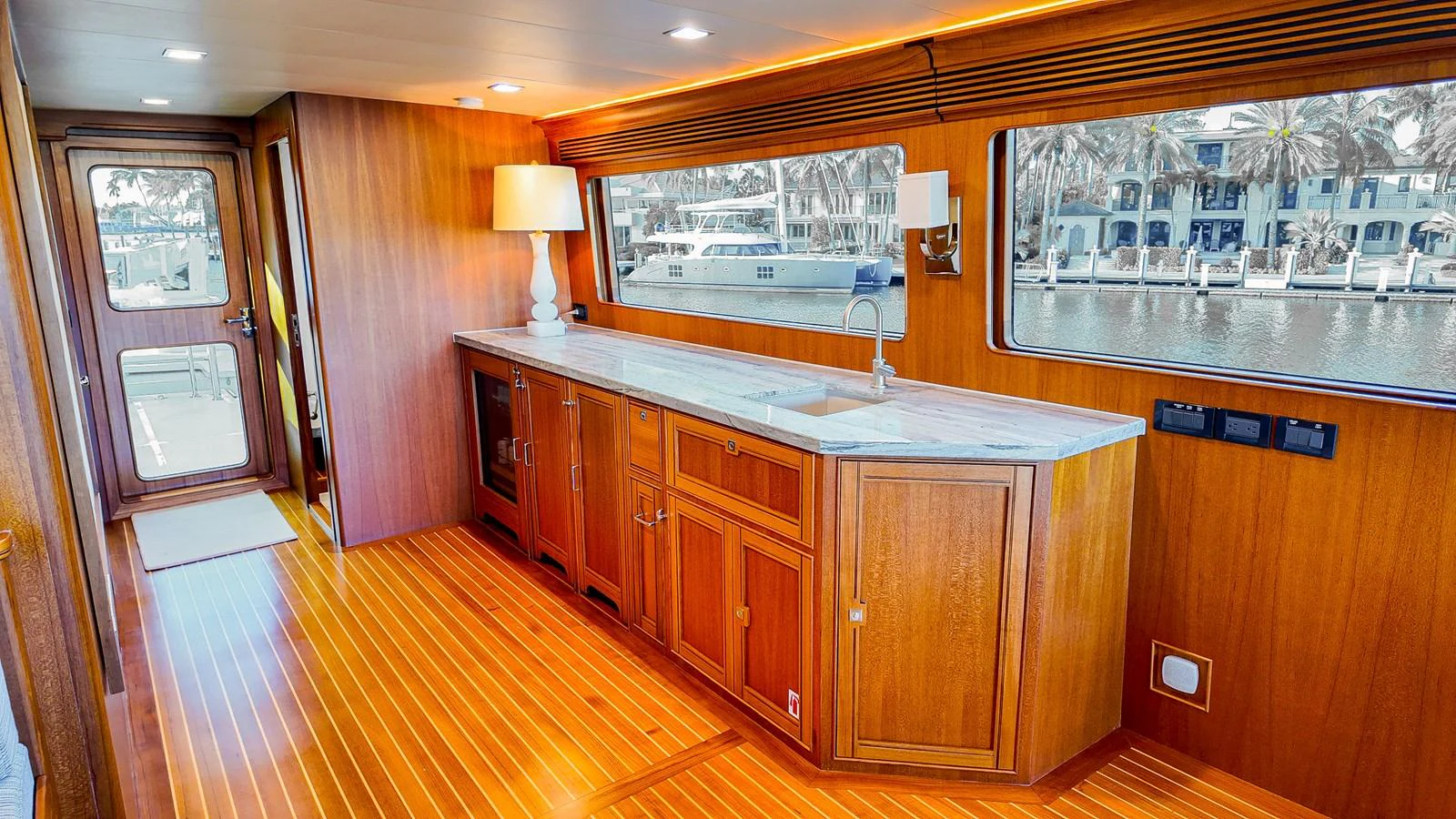 a kitchen with wooden cabinets aboard TOP TIMES Yacht for Sale