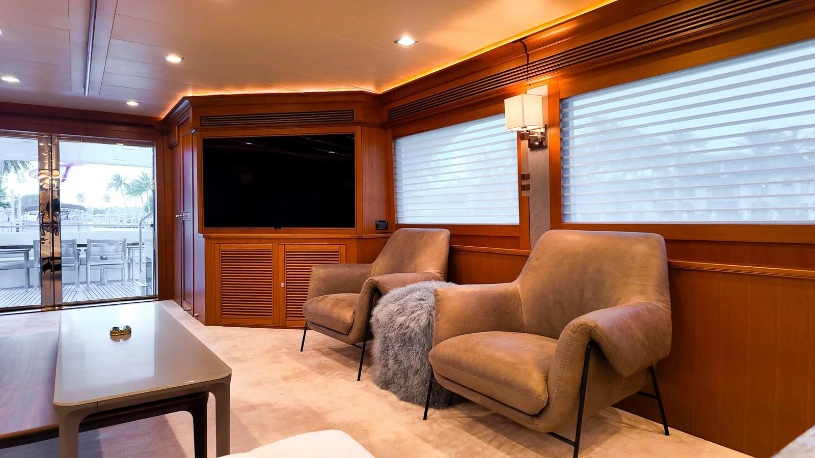 a living room with a couch and a television aboard TOP TIMES Yacht for Sale