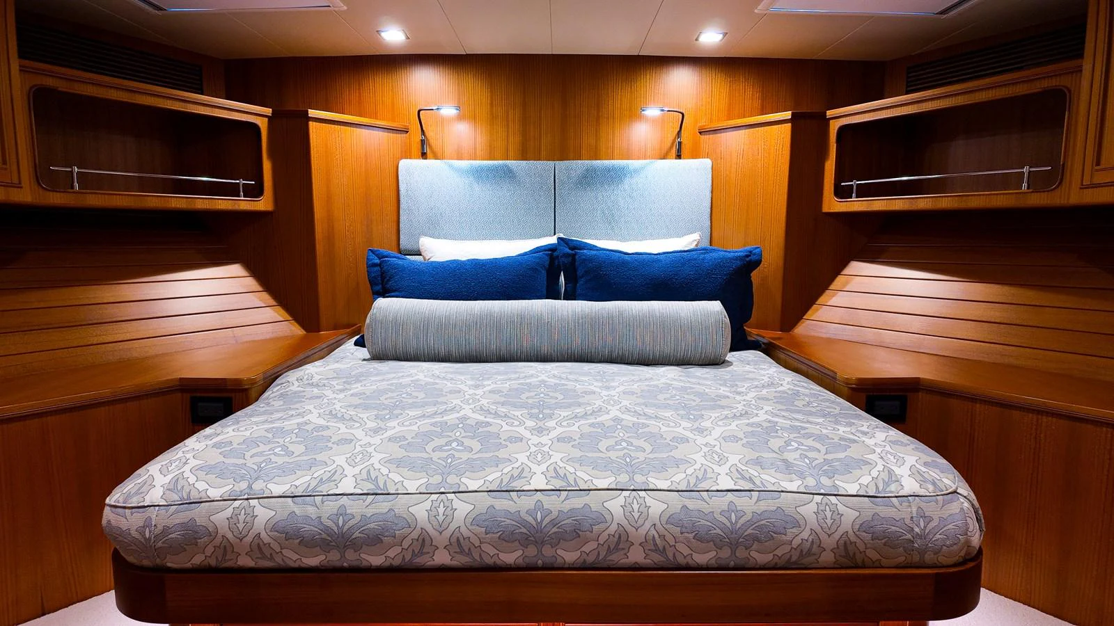 a bed with a blue pillow aboard TOP TIMES Yacht for Sale