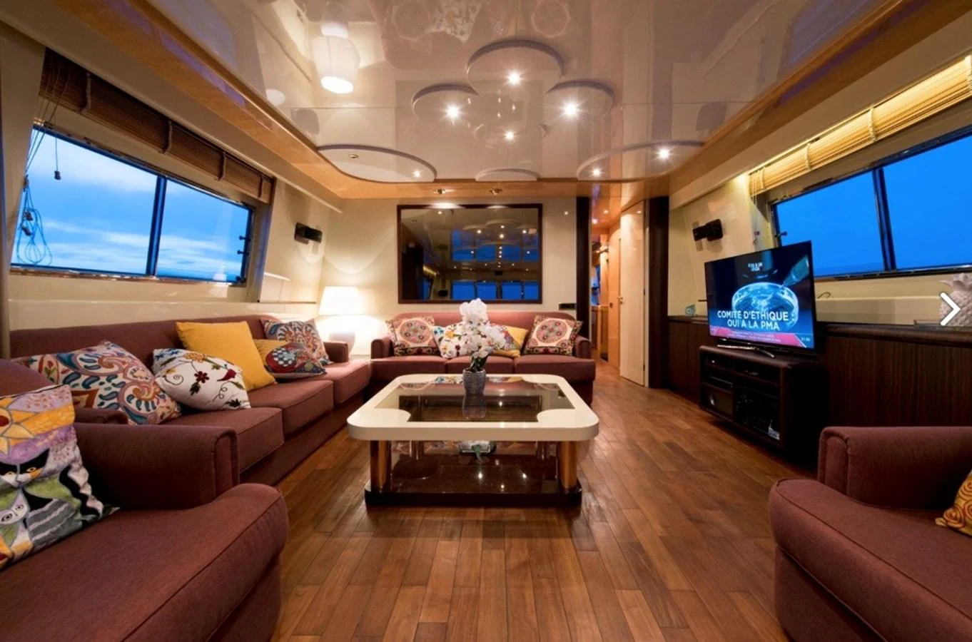 a living room with a wood floor aboard MISS CANDY Yacht for Sale