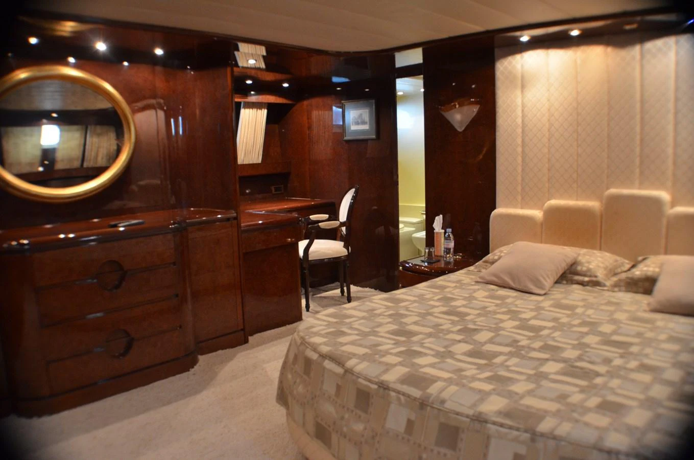 a hotel room with a bed and a desk aboard MISS CANDY Yacht for Sale