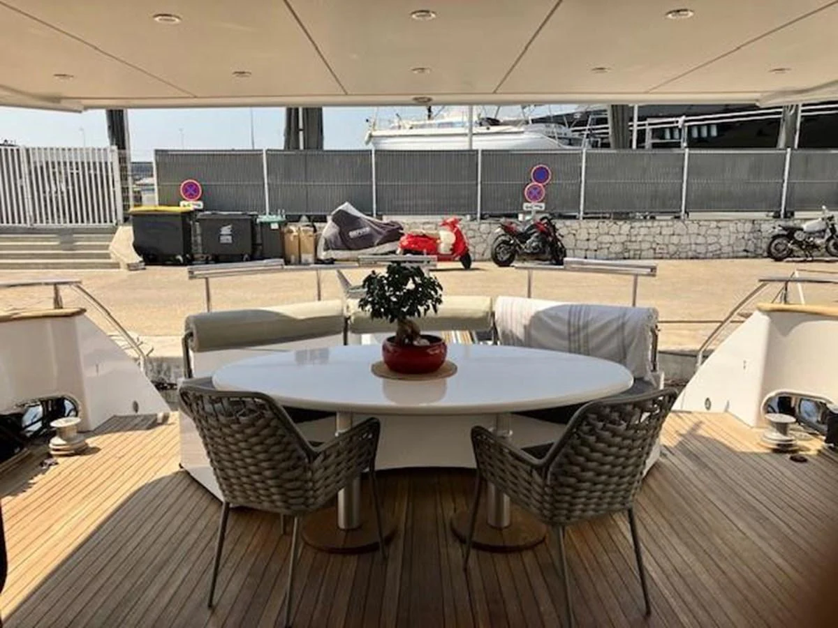 a room with a table and chairs aboard MISS CANDY Yacht for Sale