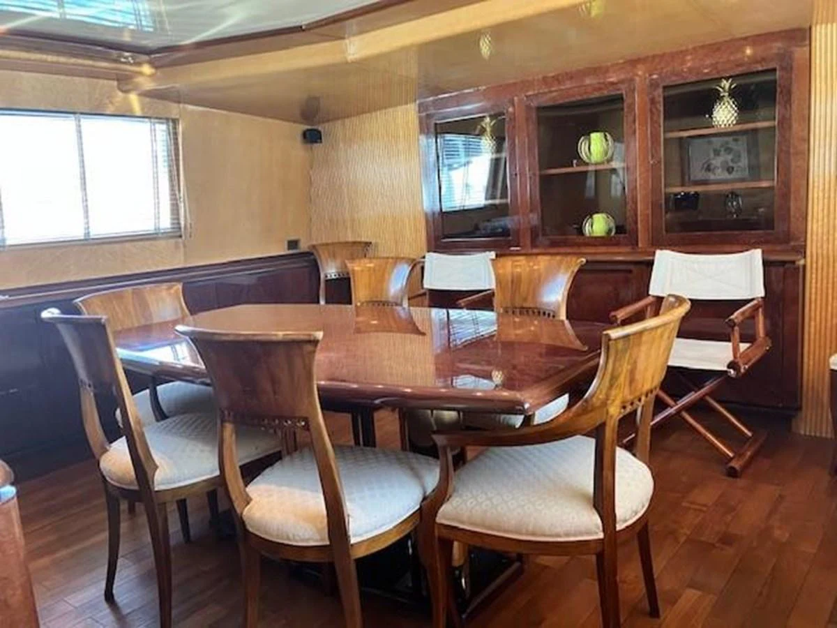 a dining room with chairs aboard MISS CANDY Yacht for Sale