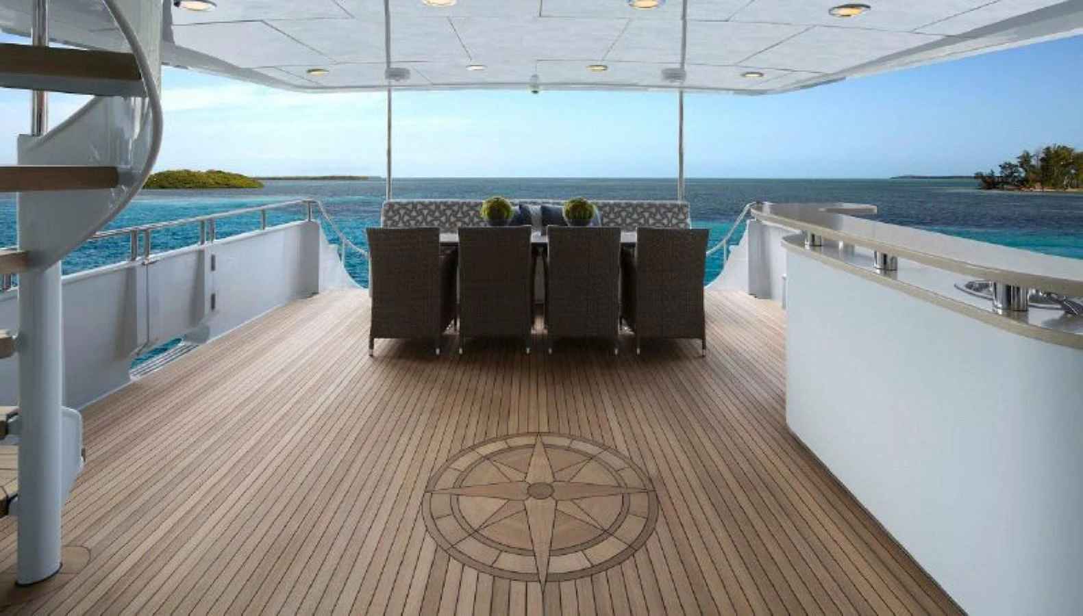 The aft deck offers a spacious and elegant dining area with stunning ocean views. aboard IRON LADY Yacht for Sale