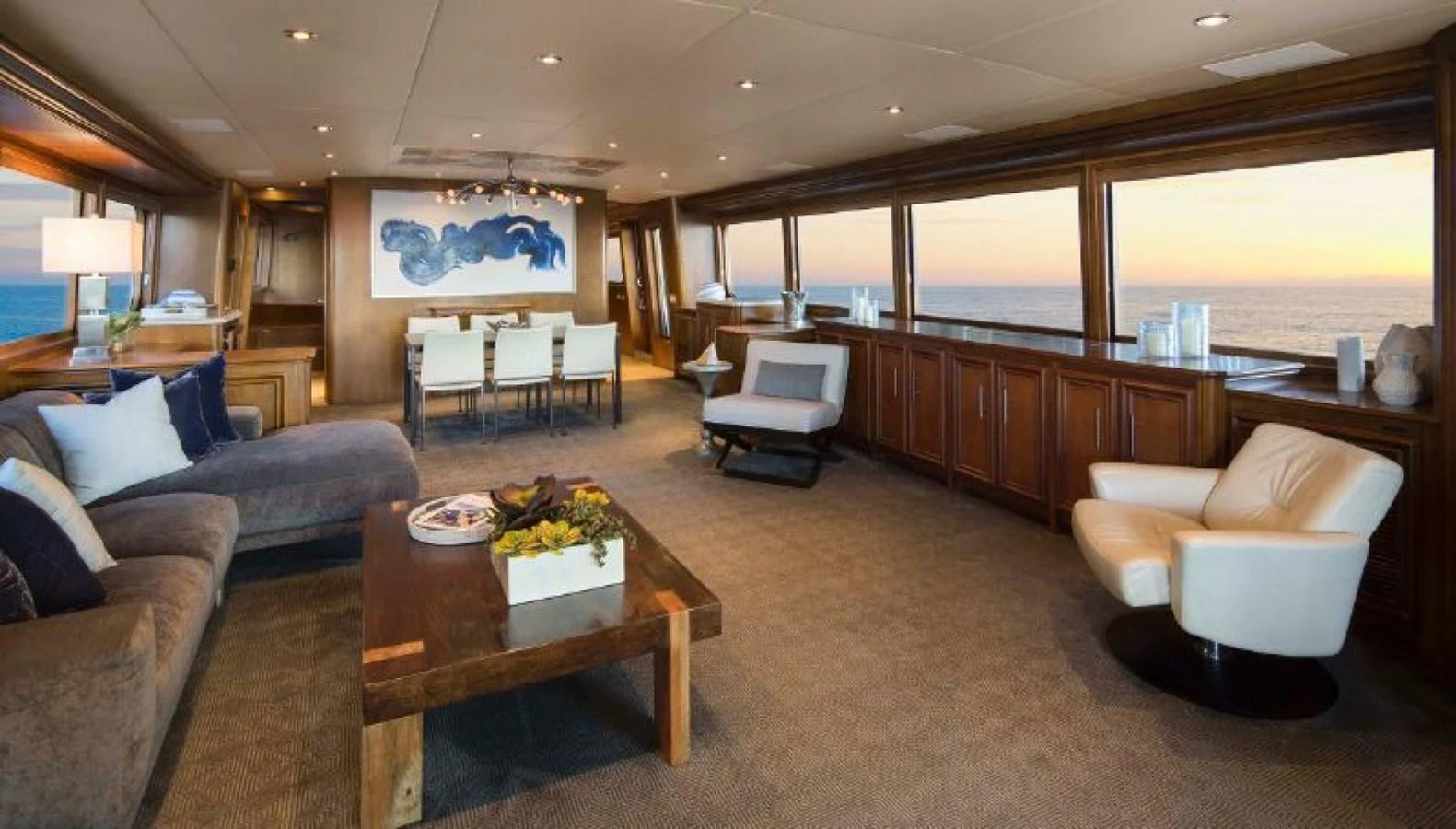 The spacious salon features elegant furnishings and panoramic ocean views. aboard IRON LADY Yacht for Sale