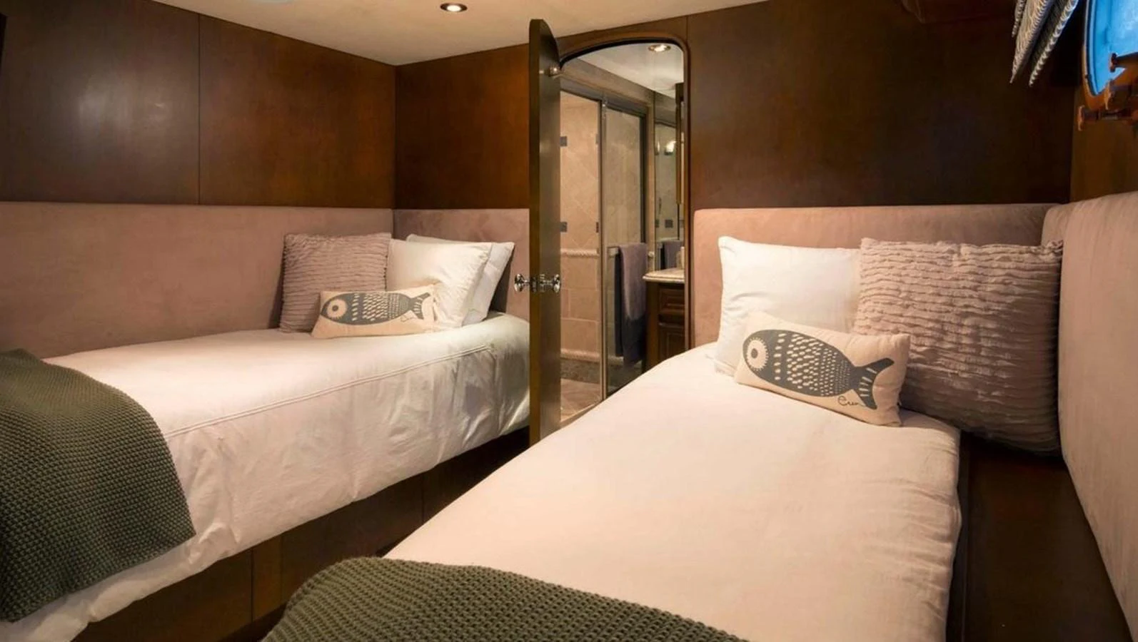 The guest stateroom features twin beds with plush bedding and a private ensuite bathroom. aboard IRON LADY Yacht for Sale