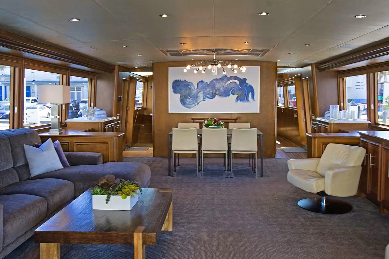 The yacht's salon features a spacious and elegantly designed living area with comfortable seating and modern decor. aboard IRON LADY Yacht for Sale