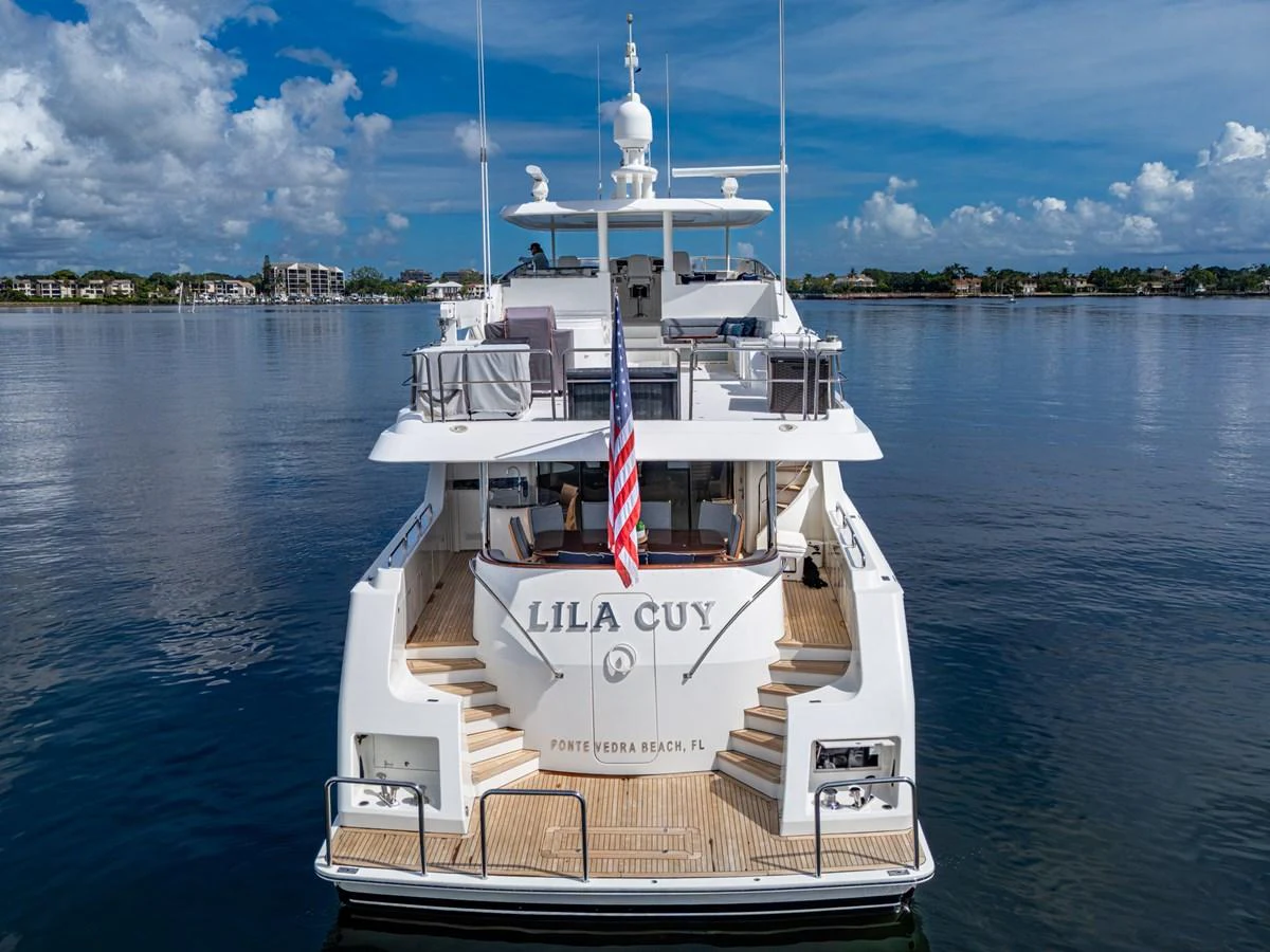 The yacht's aft deck offers a spacious and inviting area for relaxation and entertainment, with a beautiful view of the surrounding water. aboard LILA CUY Yacht for Sale
