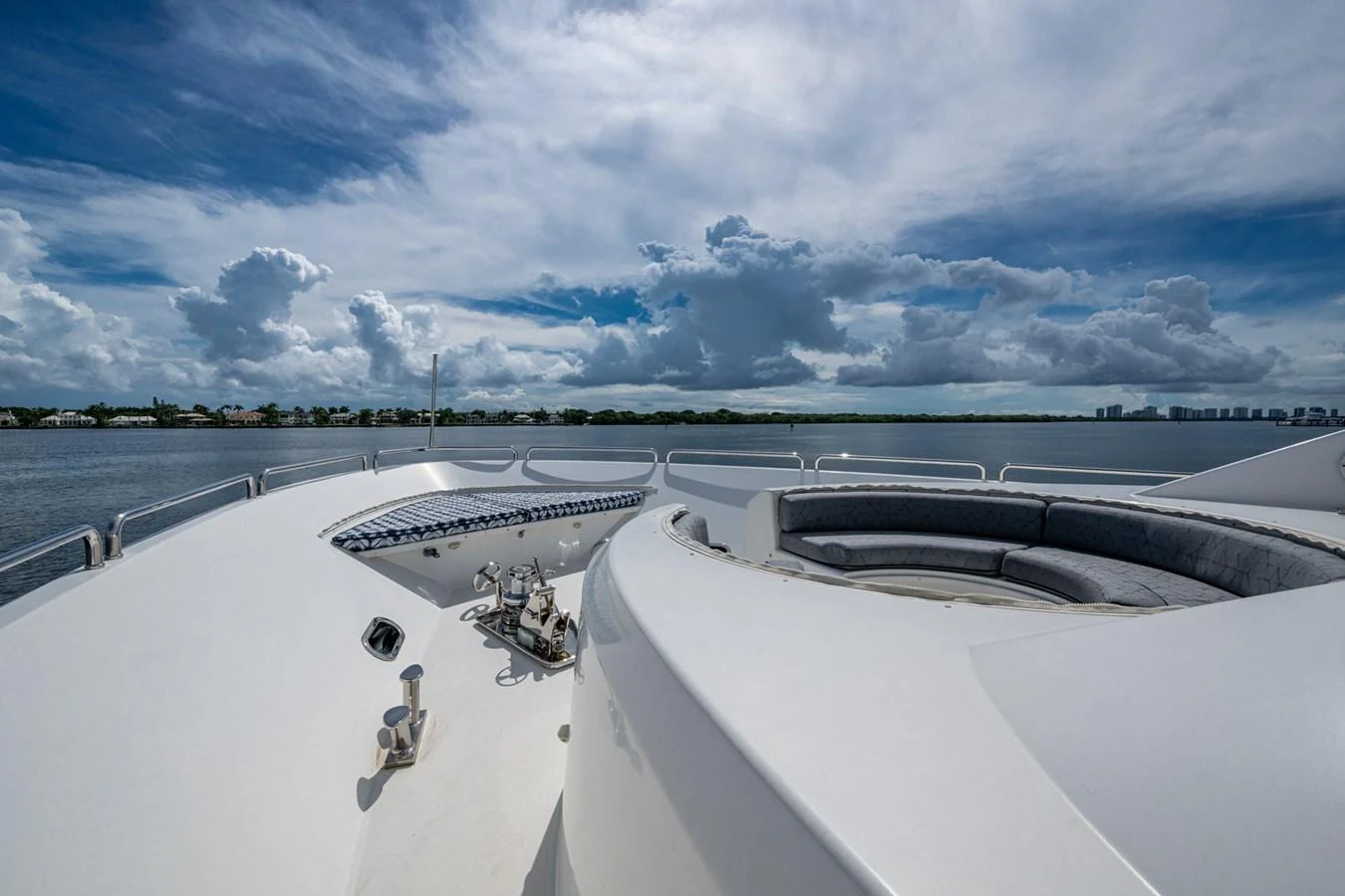 The bow of the yacht features a spacious seating area under a beautiful sky. aboard LILA CUY Yacht for Sale