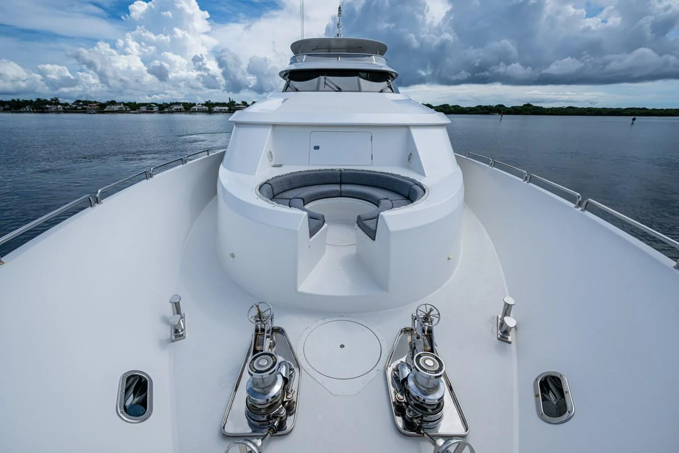 The yacht's bow features a spacious seating area with a stunning view of the water. aboard LILA CUY Yacht for Sale