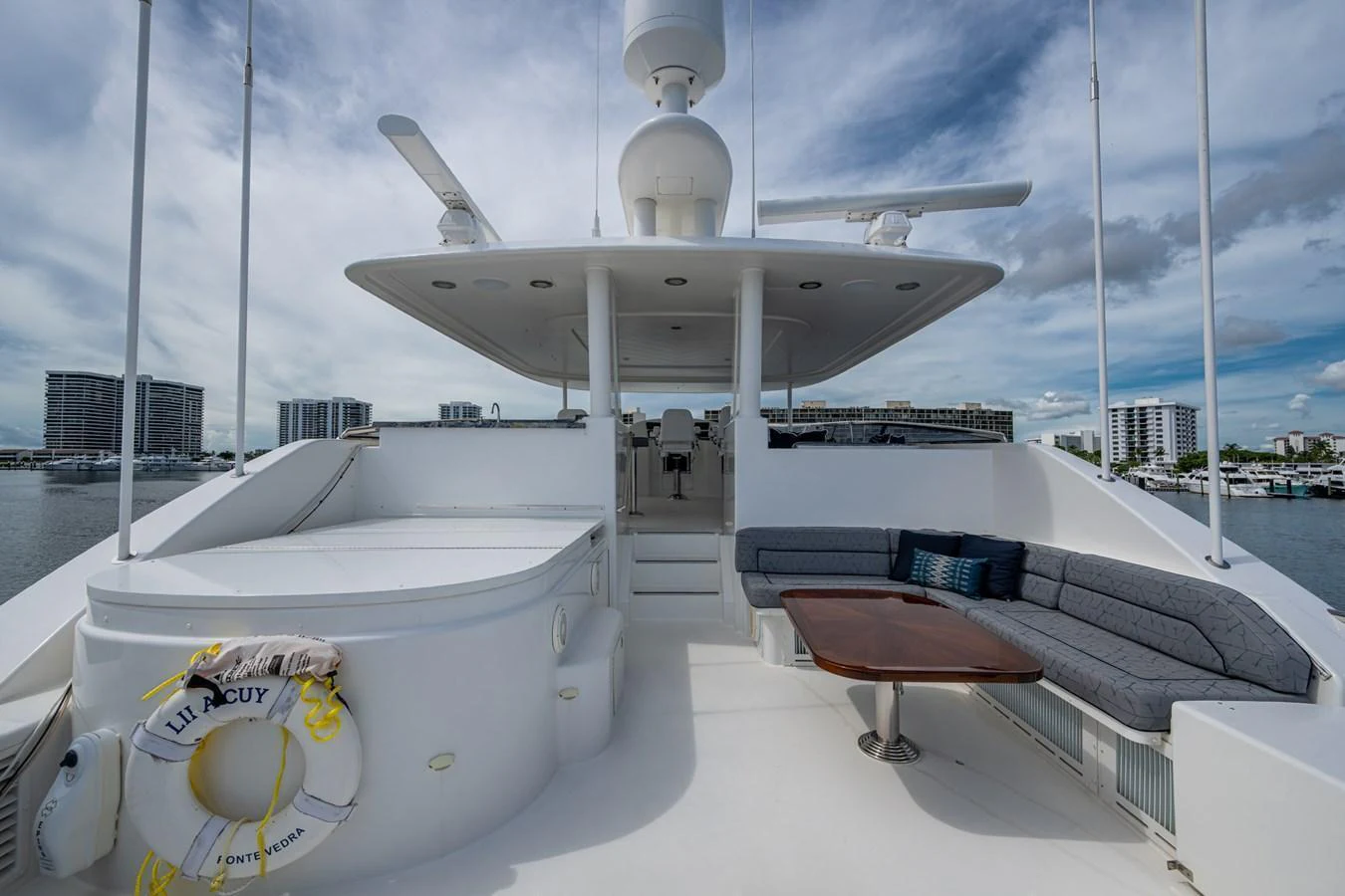 The flybridge offers a spacious and comfortable outdoor area with ample seating and a table for relaxation. aboard LILA CUY Yacht for Sale