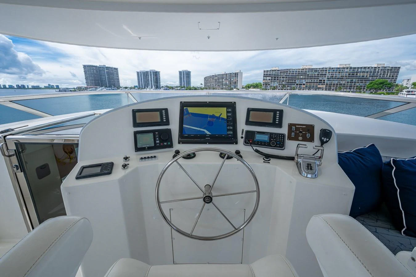 The helm station offers a commanding view with advanced navigation equipment and comfortable seating. aboard LILA CUY Yacht for Sale