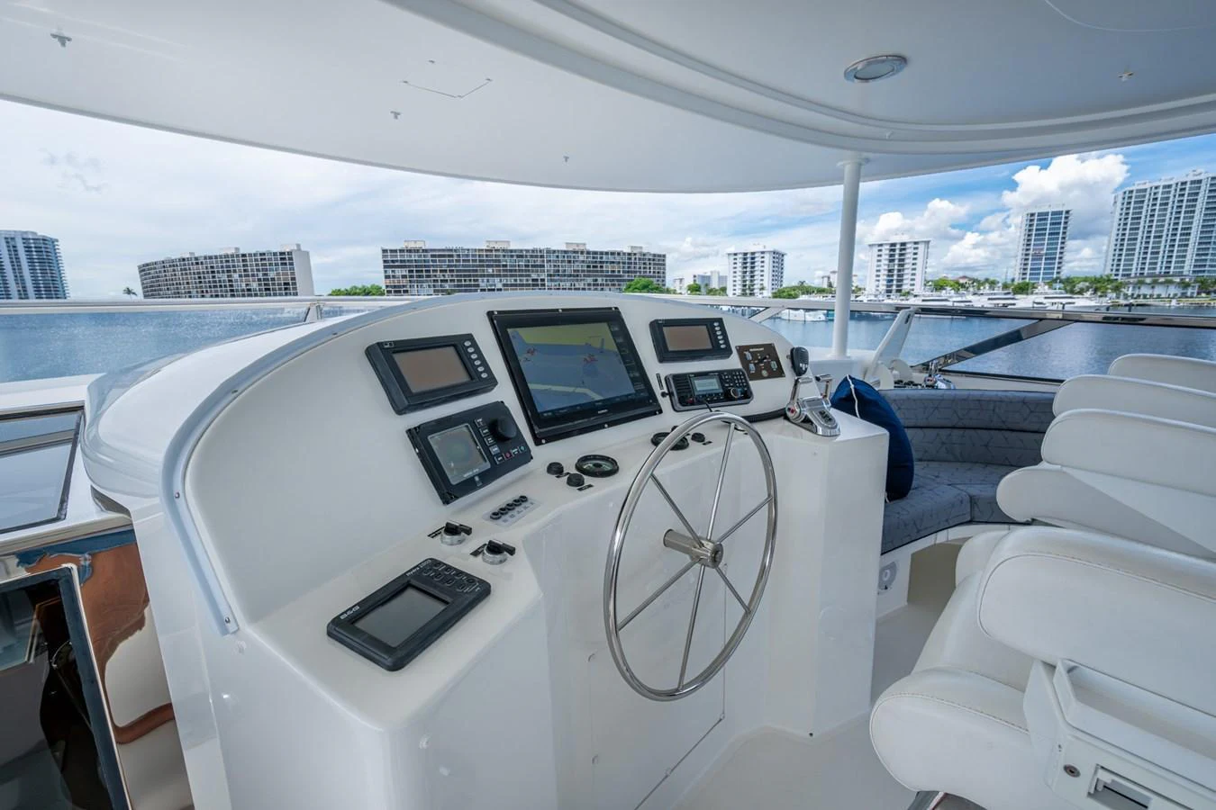 The helm station offers a modern and well-equipped control area with panoramic views of the marina. aboard LILA CUY Yacht for Sale