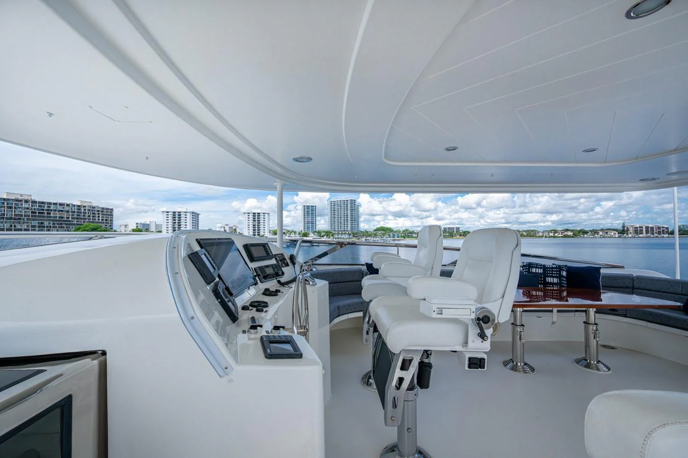 The helm station offers a commanding view with state-of-the-art navigation equipment and luxurious seating. aboard LILA CUY Yacht for Sale