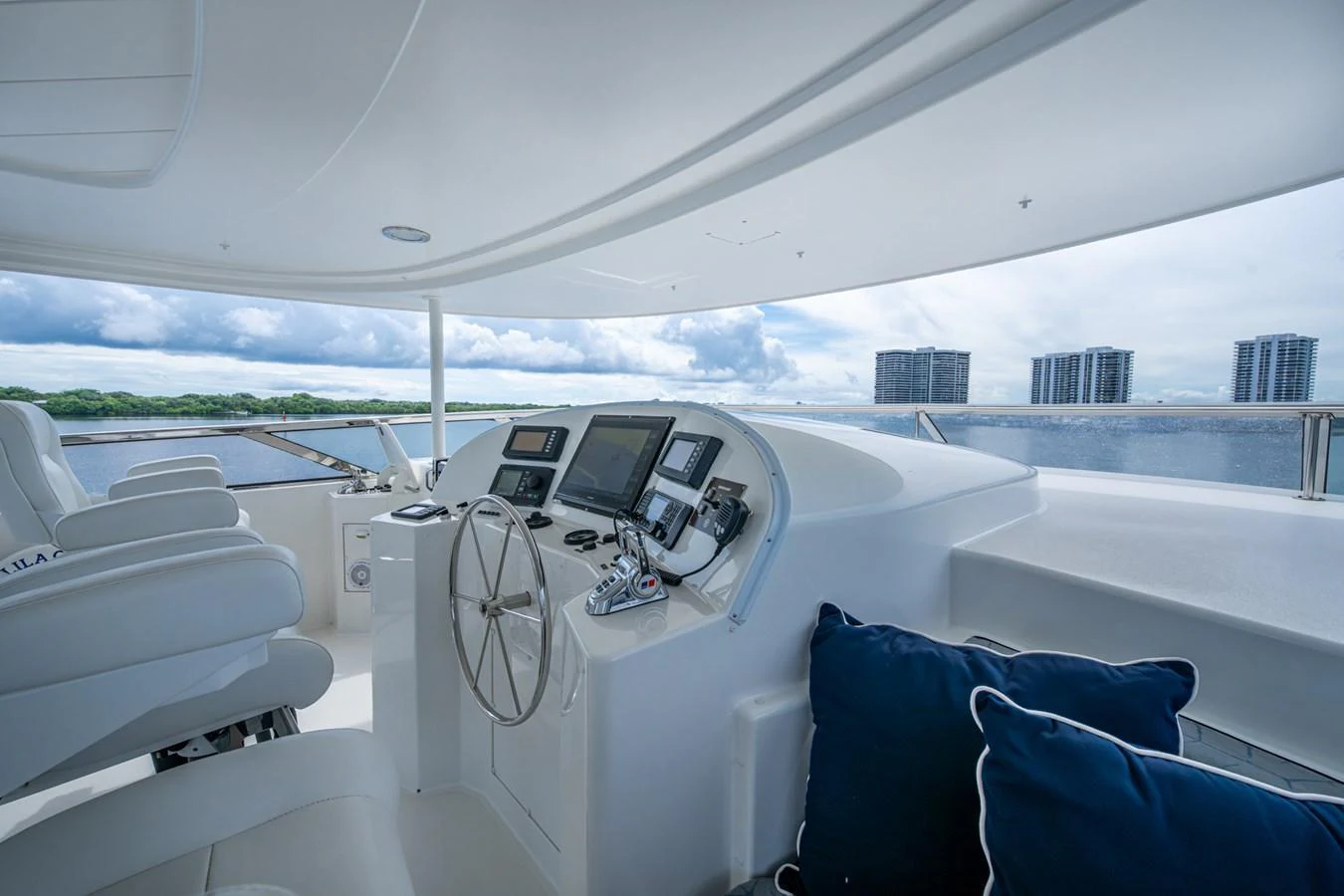 The yacht's helm offers a sleek, modern design with advanced navigation equipment and comfortable seating. aboard LILA CUY Yacht for Sale