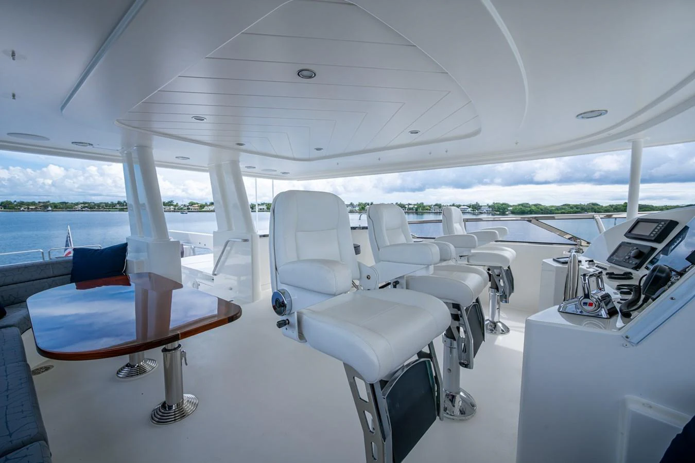 The yacht's helm area features luxurious seating and advanced navigation equipment, offering a commanding view of the surroundings. aboard LILA CUY Yacht for Sale