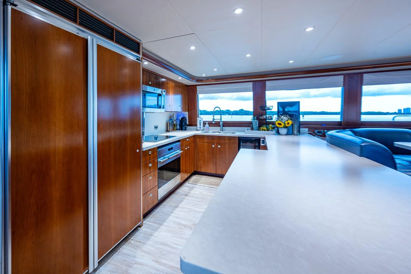 The galley features modern appliances and ample counter space with a view of the water. aboard LILA CUY Yacht for Sale