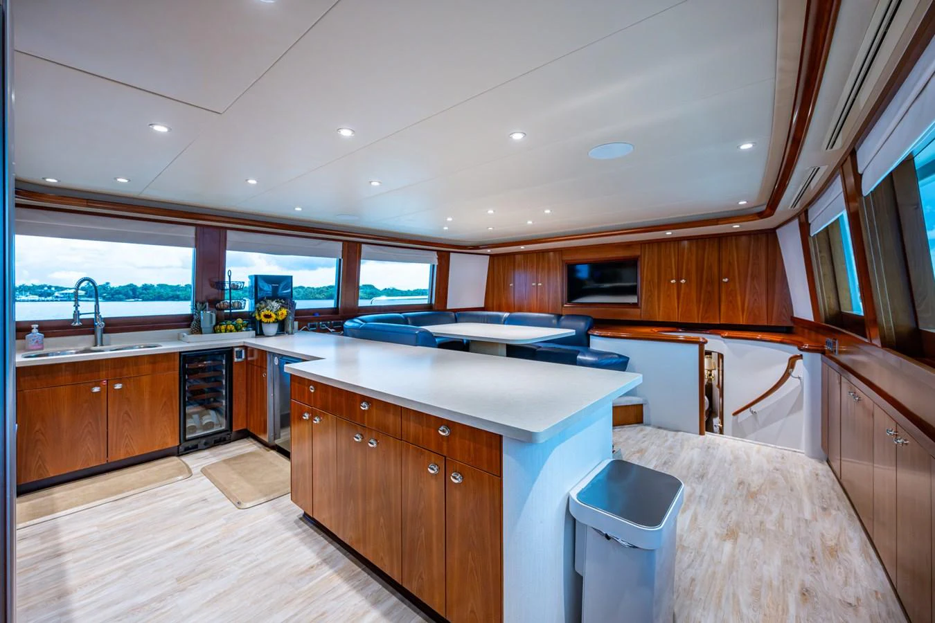 The yacht's galley features a spacious and modern design with ample counter space and large windows offering scenic views. aboard LILA CUY Yacht for Sale