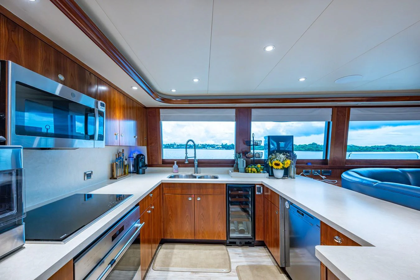 The yacht's galley is equipped with modern appliances and offers stunning views through large windows. aboard LILA CUY Yacht for Sale