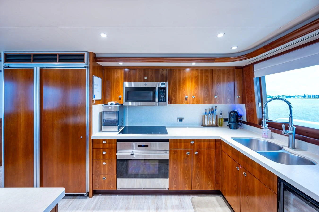 The yacht's galley features modern appliances and a sleek design with ample natural light. aboard LILA CUY Yacht for Sale