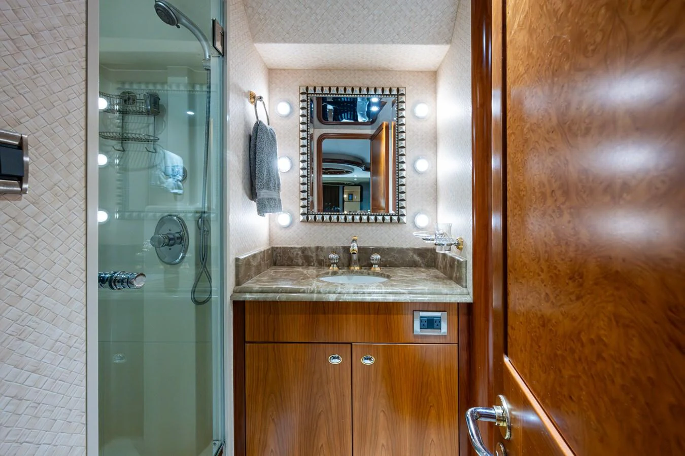 A well-appointed bathroom with a shower, vanity, and elegant lighting. aboard LILA CUY Yacht for Sale