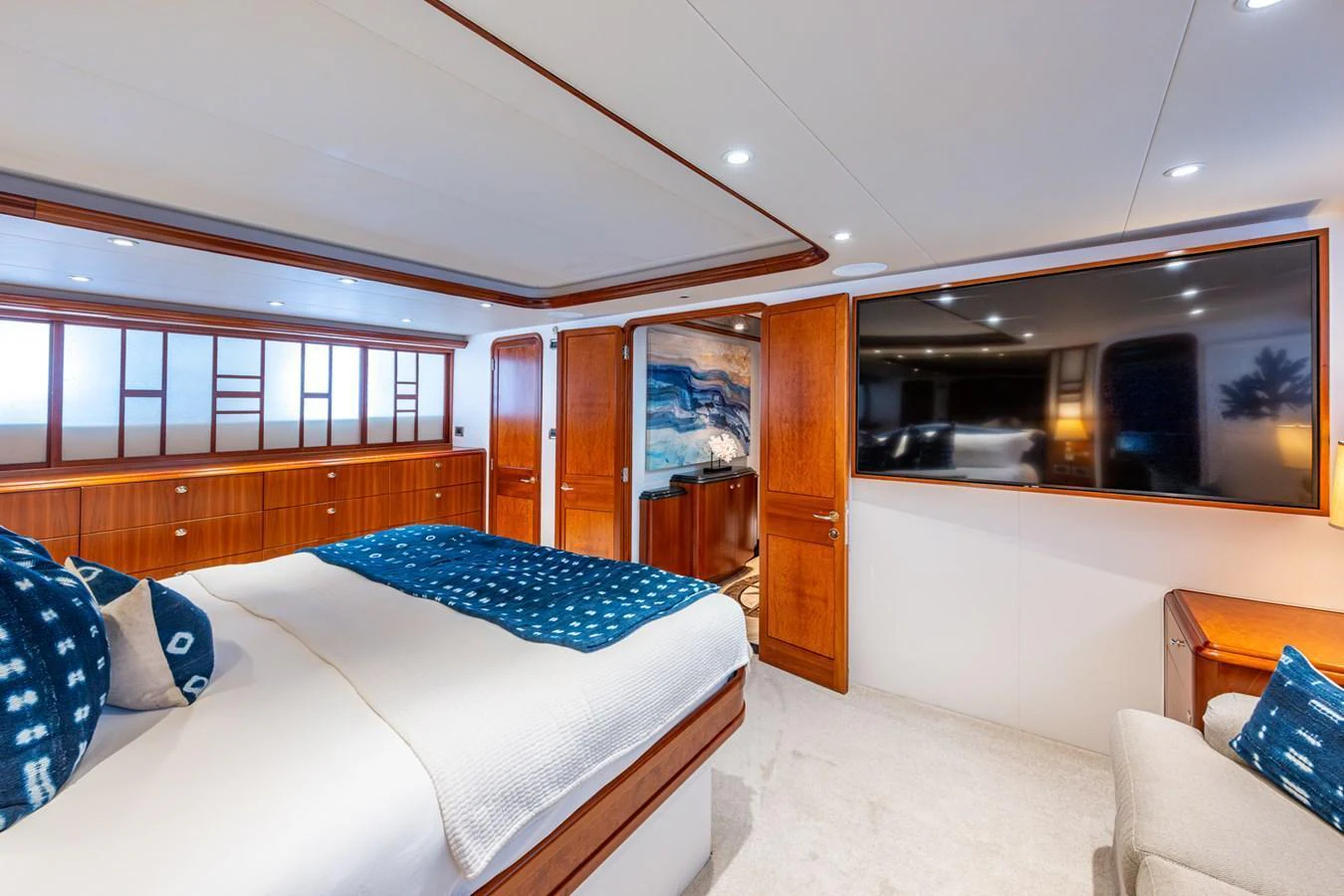 The master stateroom offers a luxurious and spacious retreat with elegant wood finishes and modern amenities. aboard LILA CUY Yacht for Sale