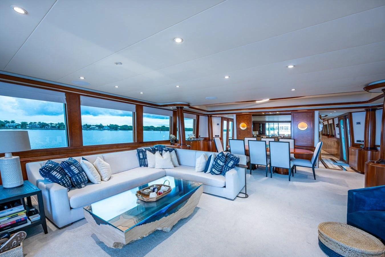 The salon features a spacious seating area with large windows offering panoramic views. aboard LILA CUY Yacht for Sale