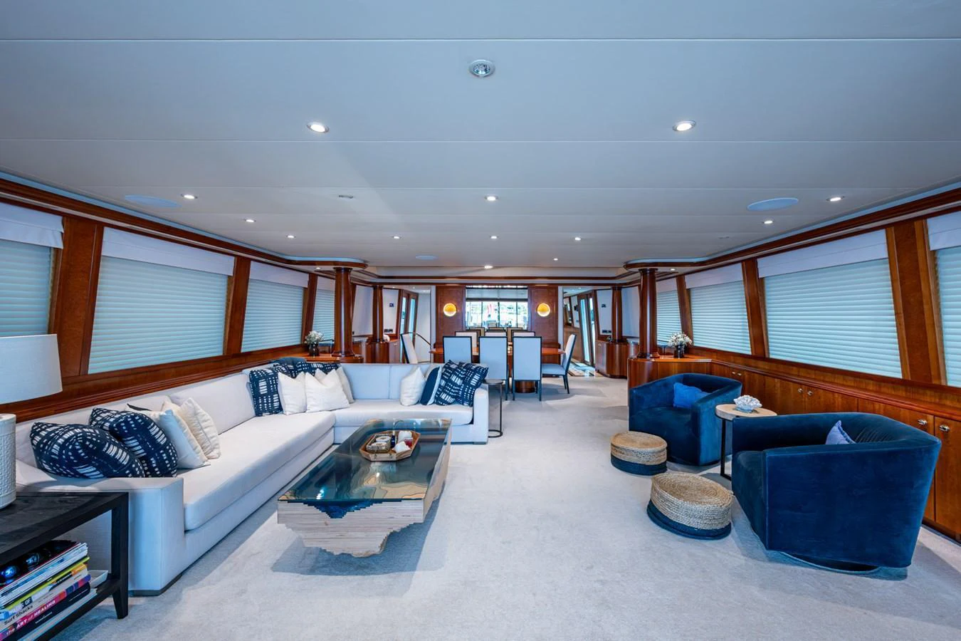 The yacht's salon features a spacious and elegantly furnished seating area with plush sofas and armchairs. aboard LILA CUY Yacht for Sale