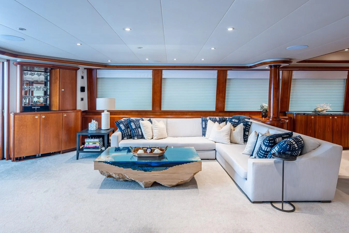 The salon features a luxurious seating area with a modern coffee table and elegant decor. aboard LILA CUY Yacht for Sale