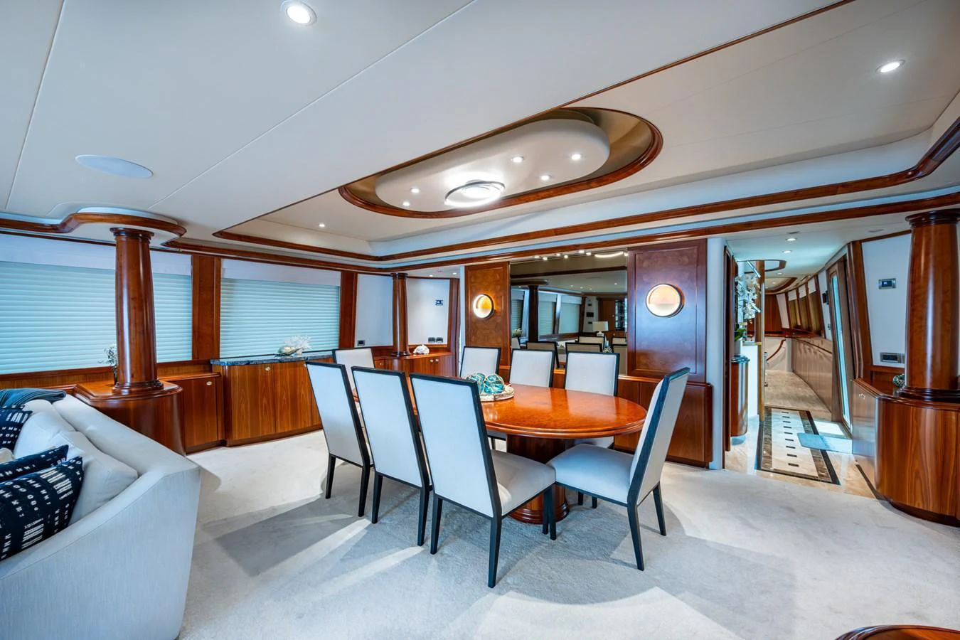 A luxurious dining area with elegant wooden finishes and comfortable seating. aboard LILA CUY Yacht for Sale