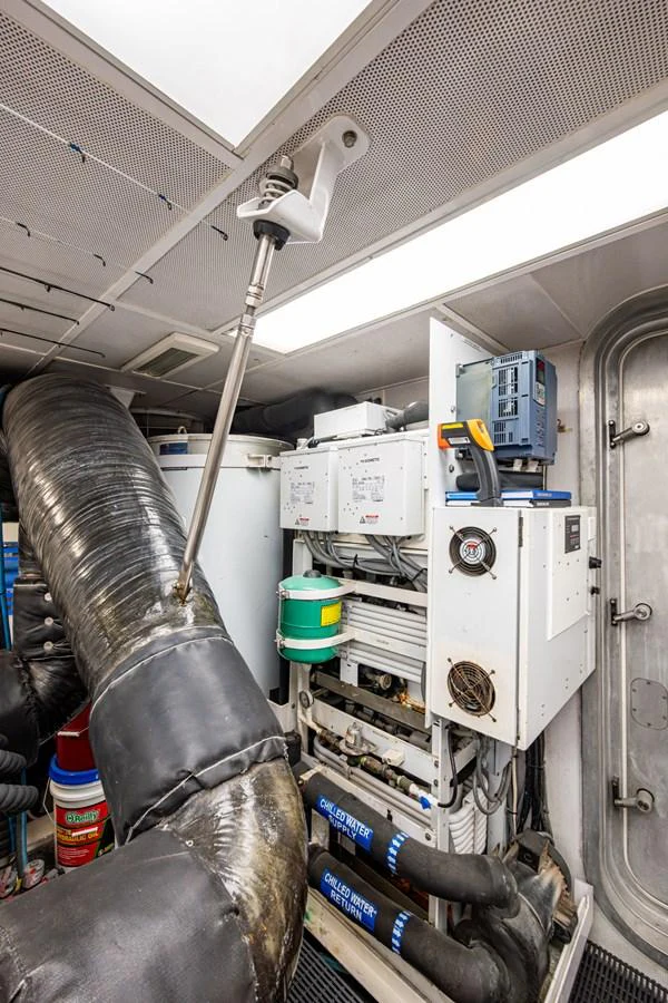 The image showcases the yacht's well-maintained engine room with advanced machinery and equipment. aboard LILA CUY Yacht for Sale