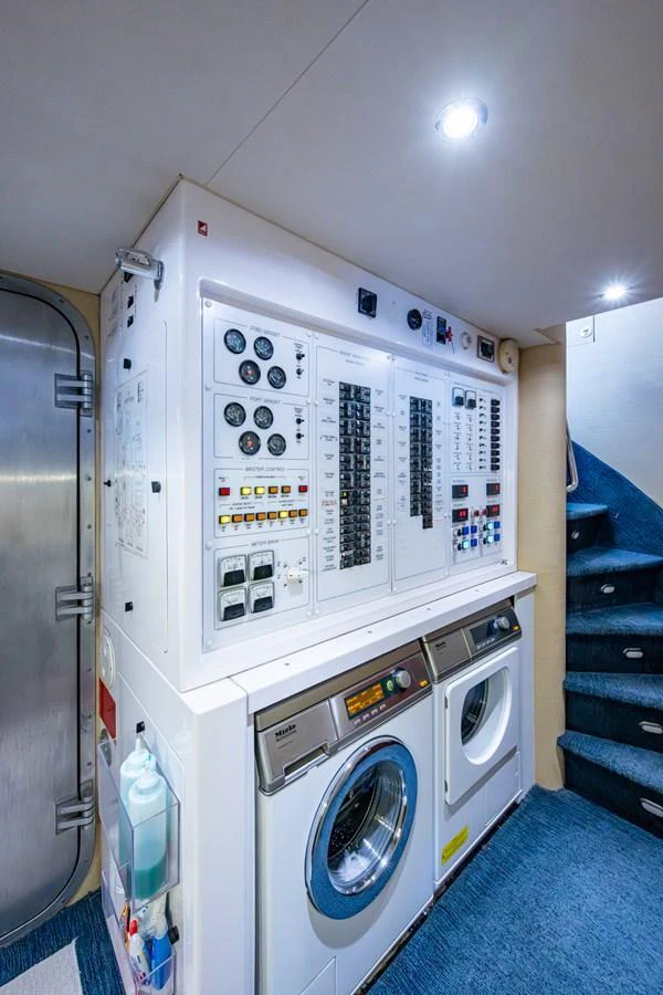 The yacht's laundry room is equipped with modern appliances and control panels for efficient onboard operations. aboard LILA CUY Yacht for Sale